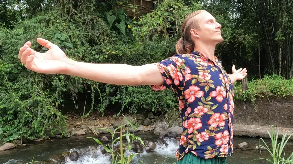 A moment of relaxed freedom beside a stream
